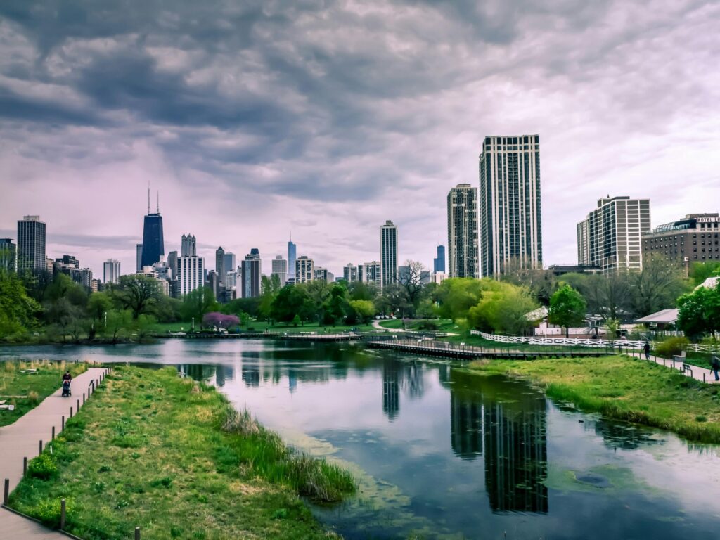 Simple Activity Ideas for a Day Out With Kids Dramatic view of Chicago skyline with reflections over Lincoln Park Lagoon on a cloudy day.